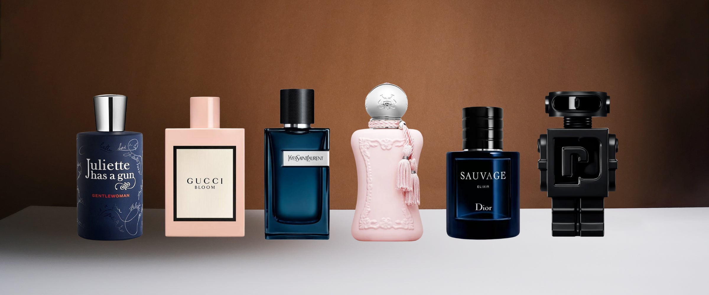 Collection of various perfume bottles on a table with a brown background Scent BLVD